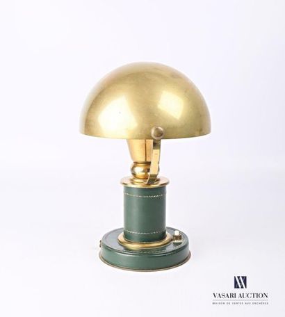 null Desk lamp in brass and quilted green leather, it rests on a round base with...