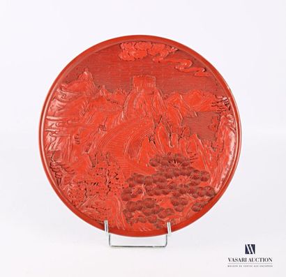 null CHINA
Nanking lacquer plate with carved decoration of a view of the Chinese...