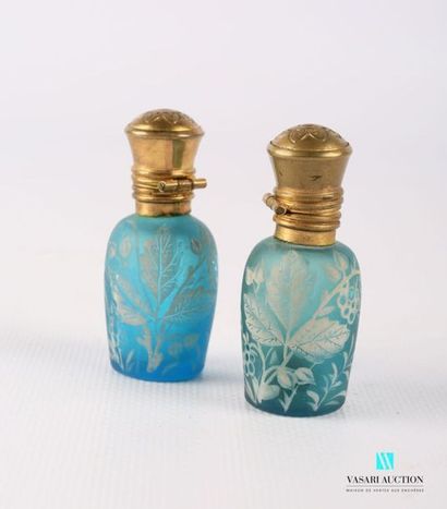 null Pair of ovoid shaped glass bottles decorated in white enamel with flowering...