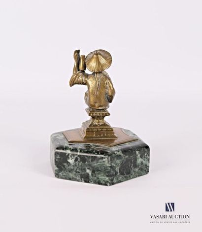 null Bronze subject featuring a sinuous figure sitting on a pedestal, sea-green marble...