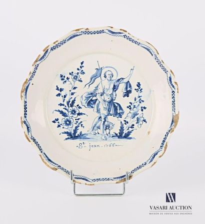 null Nevers 18th century 
Earthenware plate with contoured rim decorated in blue...