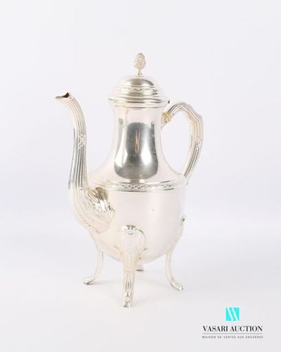 null A silver pot resting on four arched feet adorned with flutes and ribbons crossed...