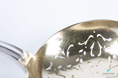 null Silver sprinkling spoon, the handle decorated with a net is finished with a...
