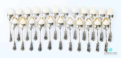 null A suite of twenty-three teaspoons in gilt metal, the handle decorated with flower-decorated...
