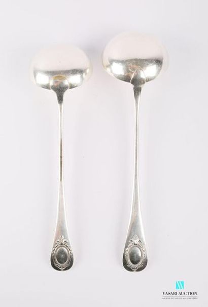 null Two silver-plated metal ladles, the handle decorated with a blind medallion...