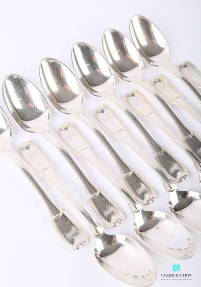 null A suite of twelve teaspoons, the silver handle decorated with a slightly protruding...