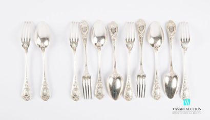 null A suite of five pieces of cutlery and a silver table fork, the handle decorated...