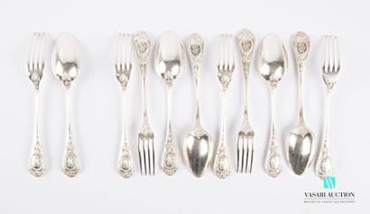 null A suite of five pieces of cutlery and a silver table fork, the handle decorated...