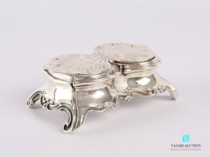 null Double silver salt shaker of rectangular shape, the moving belly ended by four...