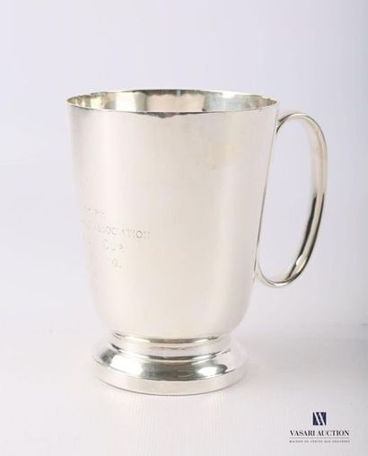 null Mug in silver plated metal in the shape of a truncated cone resting on a pedestal...