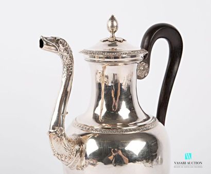 null A silver pot (1819-1838) in the form of a baluster resting on three arched feet...