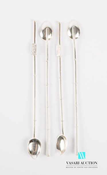 null Four silver cocktail spoons, the handle decorated with rings and two with hieroglyphic...
