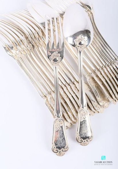 null A set of eleven pieces of cutlery and a silver table spoon, the handle decorated...
