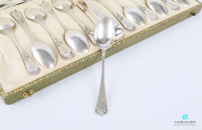 null A suite of twelve teaspoons and a silver sugar tongs, the handle decorated with...