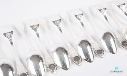 null A suite of twelve silver-plated metal cutlery sets, the handle decorated with...