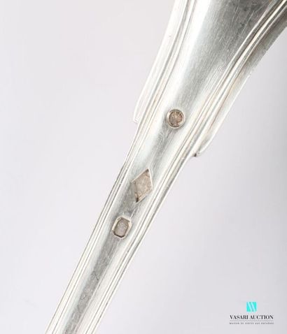 null Silver ladle (1819-1838), the handle decorated with nets and finished with the...