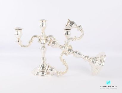 null Pair of silver candelabra on a round base with a doucine decorated with fillets...