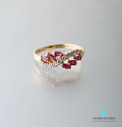 null 750 thousandths yellow gold ring set with six shuttle rubies supporting an undulating...