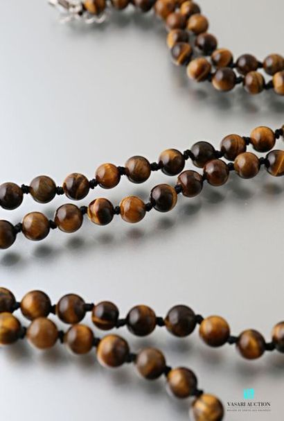 null Long necklace decorated with Tiger's eye beads, the clasp snap hook in metal
Length:...