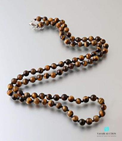 null Long necklace decorated with Tiger's eye beads, the clasp snap hook in metal
Length:...