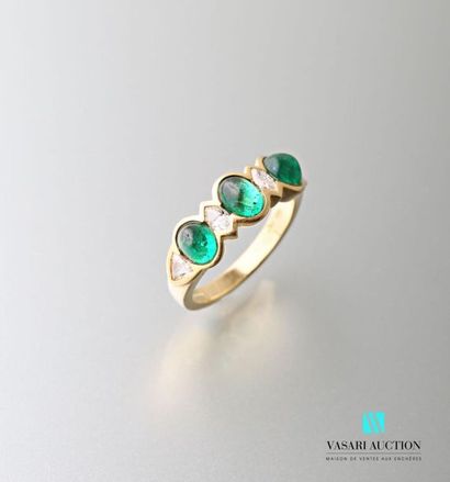 null 750 thousandths yellow gold rush ring set with three cabochon emeralds alternating...