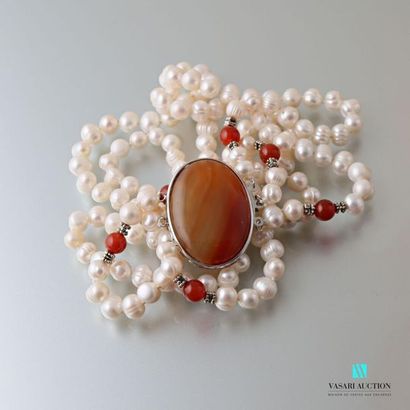 null Necklace with three rows of freshwater cultured pearls, the metal clasp adorned...