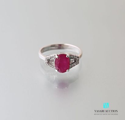 null 750 thousandths white gold ring set in its center with a ruby of approximately...