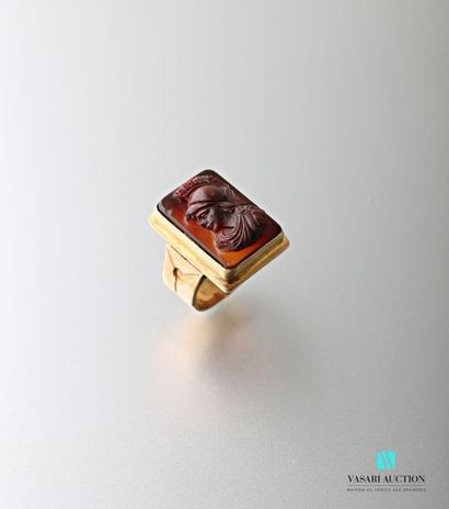 null 750 thousandths yellow gold signet ring adorned with a cameo on carnelian representing...