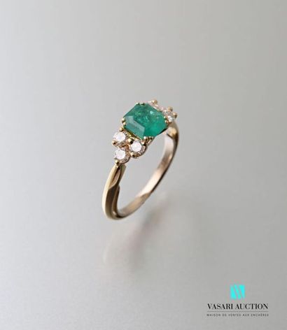 null 750 thousandths yellow gold ring set with a central square-cut emerald with...