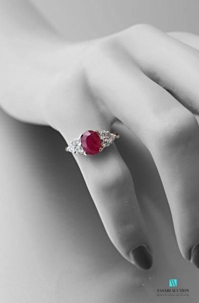 null 750 thousandths white gold ring set with an oval ruby of approximately 1.85...