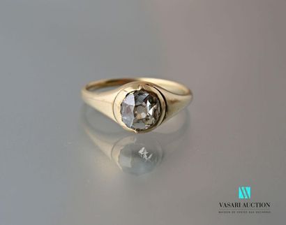 null 750 thousandths yellow gold ring set with an antique cut diamond of about 0.90...