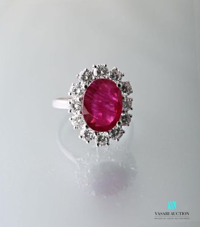 null 750 thousandth white gold pompadour ring set with a central oval ruby surrounded...