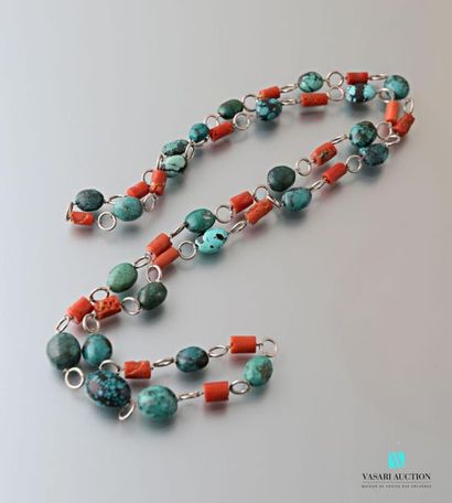 null Silver long necklace decorated with coral sticks and turquoise balls.
Gross...