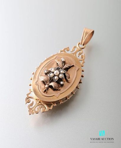 null Gold pendant opening medallion with a flower motif set with half pearls and...