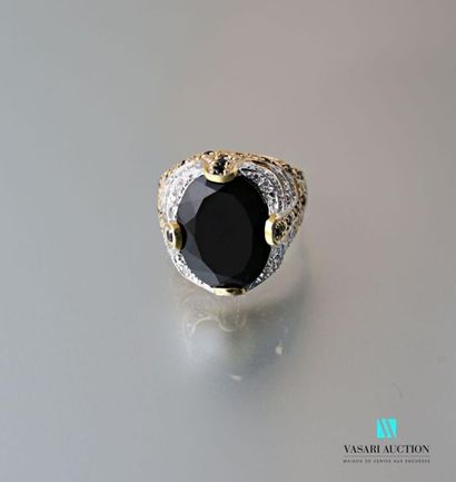 null Vermilion signet ring decorated with an oval onyx with openwork festoons.
Gross...