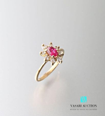 null 750 thousandths yellow gold pompadour ring set with an oval ruby surrounded...