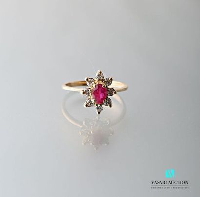 null 750 thousandths yellow gold pompadour ring set with an oval ruby surrounded...