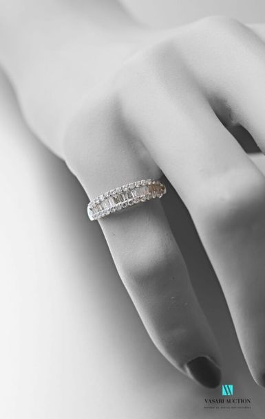 null Half wedding band in 750 thousandths white gold set with a line of baguette-cut...