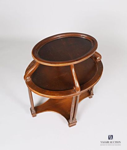 null Tea table in natural wood molded and stained in imitation of mahogany, it has...