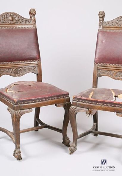  Pair of chairs in moulded and carved natural wood, the wafer back topped by a curved...