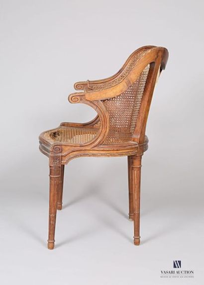  Basket armchair in moulded and carved natural wood with flower decoration, the back...