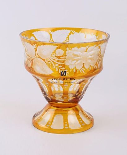 null Cup in ochre bohemian crystal, it rests on a pedestal base decorated with simulated...