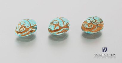 null EGYPT
Three turquoise Egyptian earthenware amulets representing beetles and...