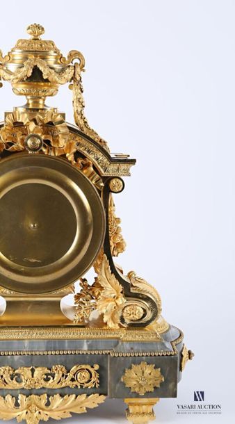 null An important ormolu clock with a round white enamelled dial with Roman numerals...