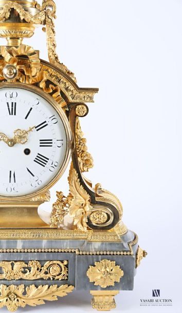 null An important ormolu clock with a round white enamelled dial with Roman numerals...