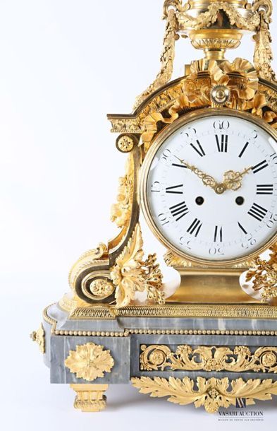 null An important ormolu clock with a round white enamelled dial with Roman numerals...