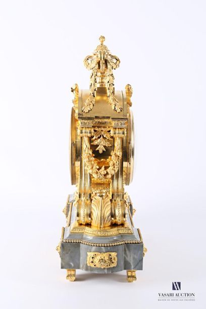 null An important ormolu clock with a round white enamelled dial with Roman numerals...