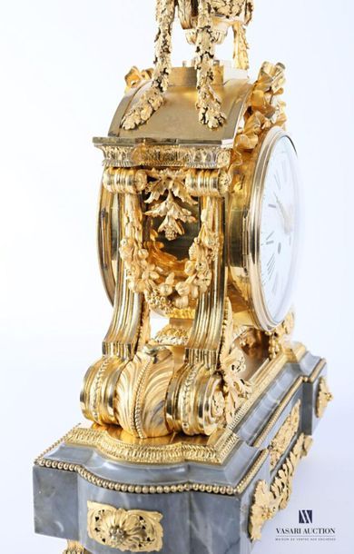 null An important ormolu clock with a round white enamelled dial with Roman numerals...