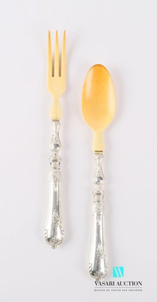 null Salad service cutlery, the silver handle filled with a violin shape decorated...