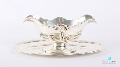 null Silver gravy boat and its frame, the border with scrolled contours hemmed with...